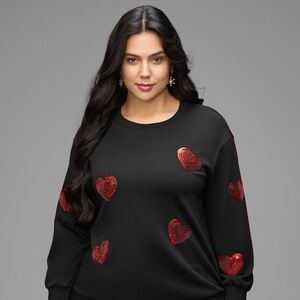 New with tags Black Sweater with red sequins hearts. Very beautiful! BloomChic